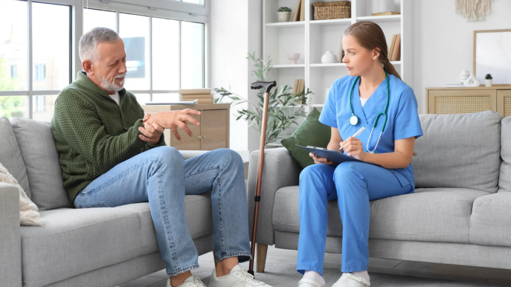 elderly man talking to an occupational therapist